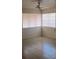 Sunlit bedroom featuring tile floors, and bright windows for a comfortable living space at 2108 E Ogden Ave, Las Vegas, NV 89101