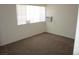 Bright bedroom featuring carpet floors, and bright windows for a comfortable living space at 2108 E Ogden Ave, Las Vegas, NV 89101