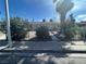 Quaint single-story home enclosed by a chain-link fence with a gravel yard at 2108 E Ogden Ave, Las Vegas, NV 89101