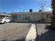 Cozy single-story home featuring a gravel yard and an inviting front entrance at 2108 E Ogden Ave, Las Vegas, NV 89101