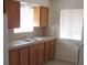 A functional kitchen with wooden cabinets and a stainless steel sink at 2108 E Ogden Ave, Las Vegas, NV 89101