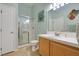 Bright bathroom featuring a walk-in shower with glass door and spacious countertop at 2110 Los Feliz St # 2064, Las Vegas, NV 89156
