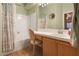 Well-lit bathroom with a shower-tub combo, tile floors and a vanity area with ample counter space at 2110 Los Feliz St # 2064, Las Vegas, NV 89156