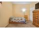 Cozy bedroom featuring carpet, natural light, and a light yellow wall color at 2110 Los Feliz St # 2064, Las Vegas, NV 89156