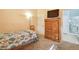 Bright bedroom with a TV on a dresser, next to an ensuite bathroom at 2110 Los Feliz St # 2064, Las Vegas, NV 89156