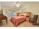 Cozy bedroom features a ceiling fan, window with blinds, and built in shelving at 2110 Los Feliz St # 2064, Las Vegas, NV 89156