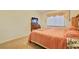 Inviting bedroom with a ceiling fan, carpeted floors, and a large window at 2110 Los Feliz St # 2064, Las Vegas, NV 89156