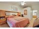 Comfortable bedroom with carpeted floors, built-in headboard and easy access to the en-suite bathroom at 2110 Los Feliz St # 2064, Las Vegas, NV 89156