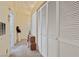 Hallway featuring a built-in storage, neutral colored walls, and carpeted floors at 2110 Los Feliz St # 2064, Las Vegas, NV 89156