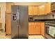 Bright kitchen featuring stainless steel appliances, light wood cabinets, and tile flooring at 2110 Los Feliz St # 2064, Las Vegas, NV 89156