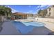 A stunning pool featuring a hot tub and lounge chairs with a nearby parking area at 2110 Los Feliz St # 2064, Las Vegas, NV 89156