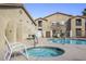 Community pool and hot tub offer residents a relaxing outdoor retreat and leisure space at 2110 Los Feliz St # 2064, Las Vegas, NV 89156