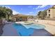 A stunning pool featuring a hot tub and lounge chairs with shaded parking nearby at 2110 Los Feliz St # 2064, Las Vegas, NV 89156