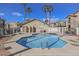 The community pool offers a refreshing oasis surrounded by lounge chairs and tropical palm trees at 2110 Los Feliz St # 2064, Las Vegas, NV 89156