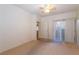 Bedroom with neutral carpet has a ceiling fan and a sliding door that provides outdoor access at 2152 Turquoise Ridge St # 105, Las Vegas, NV 89117