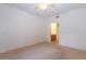 Spacious bedroom with soft carpeting and an adjoining bathroom, promoting relaxation at 2152 Turquoise Ridge St # 105, Las Vegas, NV 89117