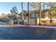 Stone Ridge Community signage with a gate entrance, palm trees, and visible building addresses at 2152 Turquoise Ridge St # 105, Las Vegas, NV 89117
