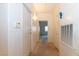 Hallway features neutral-toned flooring and access to several rooms and storage areas at 2152 Turquoise Ridge St # 105, Las Vegas, NV 89117