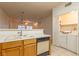 Efficient kitchen with a breakfast bar open to living room, plus laundry closet at 2152 Turquoise Ridge St # 105, Las Vegas, NV 89117