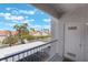 Balcony view showcasing lush greenery, palm trees, and covered parking at 2201 Ramsgate Dr # 823, Henderson, NV 89074