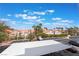 Balcony view featuring a neighborhood of homes, palm trees and covered parking at 2201 Ramsgate Dr # 823, Henderson, NV 89074