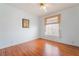 Bright bedroom featuring wood-look flooring and a sunny window at 2201 Ramsgate Dr # 823, Henderson, NV 89074