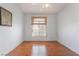 Bedroom with wood-look floors and a window with blinds at 2201 Ramsgate Dr # 823, Henderson, NV 89074