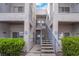 Exterior view of a well-maintained apartment building with stairs leading to the upper units at 2201 Ramsgate Dr # 823, Henderson, NV 89074