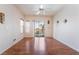Spacious living room with wood-look floors and sliding glass doors to a balcony at 2201 Ramsgate Dr # 823, Henderson, NV 89074