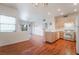 Open-concept living area with balcony access, updated fixtures and laminate flooring at 2201 Ramsgate Dr # 823, Henderson, NV 89074