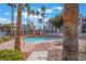 Enjoy the community pool surrounded by mature palm trees, providing a resort-style experience at 2201 Ramsgate Dr # 823, Henderson, NV 89074