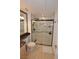 Bathroom showcasing a new shower with glass doors, granite counters, and tiled flooring at 230 E Flamingo Rd # 229, Las Vegas, NV 89169