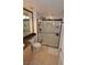 Modern bathroom with a glass-enclosed shower and granite vanity top at 230 E Flamingo Rd # 229, Las Vegas, NV 89169