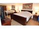 Comfortable bedroom with mirrored closet doors, a queen-sized bed, and side tables at 230 E Flamingo Rd # 229, Las Vegas, NV 89169