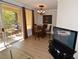 Cozy dining area with a round table, balcony access, and stylish chandelier lighting at 230 E Flamingo Rd # 229, Las Vegas, NV 89169