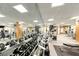 Bright gym featuring free weights, weight machines, and a mirrored wall at 230 E Flamingo Rd # 229, Las Vegas, NV 89169