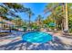 Inviting hot tub surrounded by lush greenery and seating, ideal for relaxation at 230 E Flamingo Rd # 229, Las Vegas, NV 89169