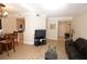 Open-concept living room with views of the kitchen, dining area and doorway, all with light colored wood flooring at 230 E Flamingo Rd # 229, Las Vegas, NV 89169
