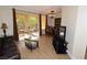 Cozy living room with a leather couch and a balcony featuring outdoor seating at 230 E Flamingo Rd # 229, Las Vegas, NV 89169
