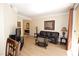 Comfortable living room featuring a leather sofa, glass table, and television set at 230 E Flamingo Rd # 229, Las Vegas, NV 89169