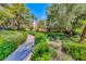 Beautifully landscaped path leading through lush green community at The Meridian Private Residences at 230 E Flamingo Rd # 229, Las Vegas, NV 89169