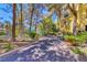 Brick walkway through tree-shaded community at The Meridian Private Residences, Las Vegas at 230 E Flamingo Rd # 229, Las Vegas, NV 89169