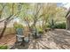 Backyard patio with Adirondack chairs, arbor, desert landscaping and pavers offering an ideal spot for outdoor enjoyment at 2306 Valley Cottage Ave, Henderson, NV 89052