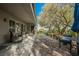 A spacious backyard patio features comfortable seating and views of mature trees and landscaping at 2306 Valley Cottage Ave, Henderson, NV 89052