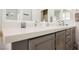 Bathroom vanity with dual sinks, a large mirror, and plenty of counter space at 2306 Valley Cottage Ave, Henderson, NV 89052