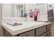 Elegant bathroom vanity featuring a marble countertop, gray cabinets, and chrome faucet at 2306 Valley Cottage Ave, Henderson, NV 89052