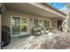 Covered patio with seamless indoor/outdoor living and modern sliding door, perfect for relaxing or entertaining friends and Gathering at 2306 Valley Cottage Ave, Henderson, NV 89052