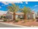 Beautiful single-story home with lush desert landscaping, tile roof, and well-maintained front yard at 2306 Valley Cottage Ave, Henderson, NV 89052