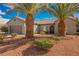 Beautiful single-story home with a three-car garage, mature landscaping, and covered entry at 2306 Valley Cottage Ave, Henderson, NV 89052