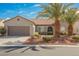 Charming single-story home featuring desert landscaping, a tile roof, and a two-car garage at 2306 Valley Cottage Ave, Henderson, NV 89052